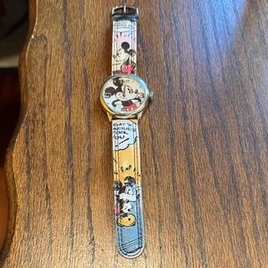 Disney Mickey Mouse watch, silver-tone case & multicolored cartoon-themed band.